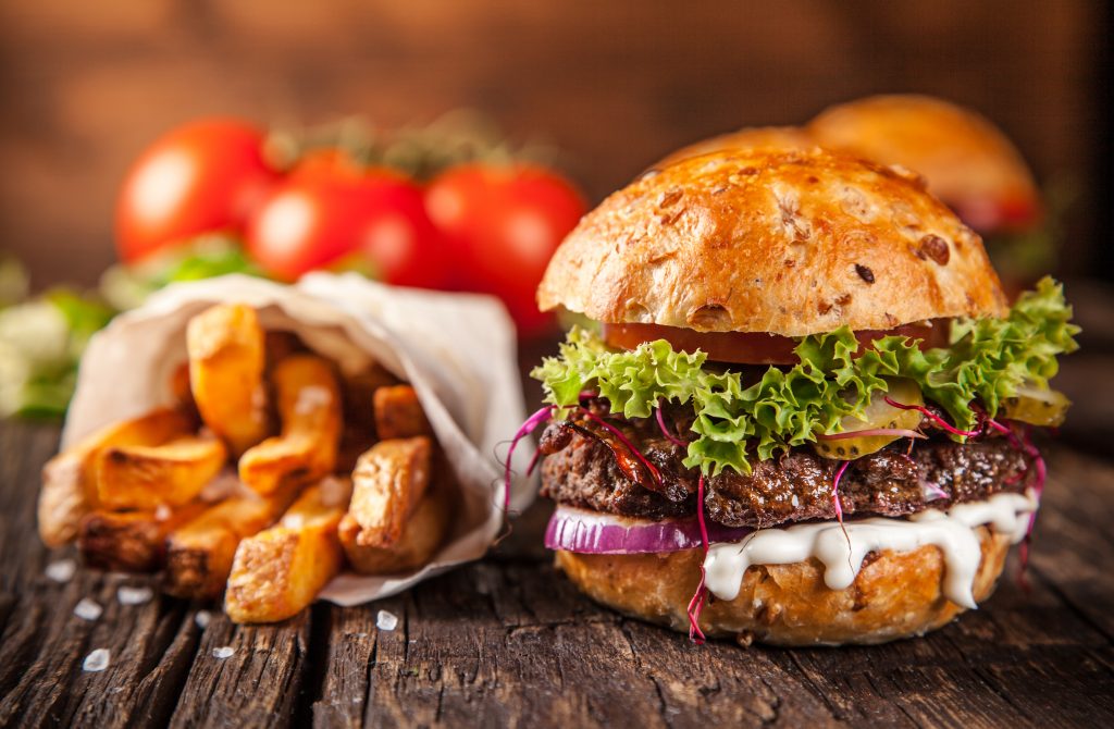 Close-up of gourmet burgers on wooden background
