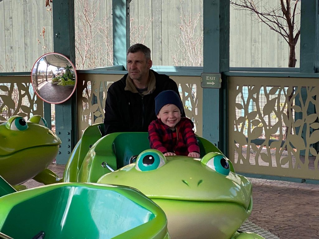 The author's husband and youngest son on a ride at Dollywood