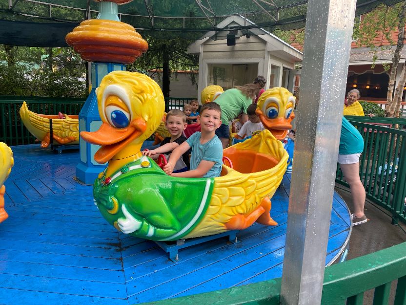 two of the author's sons on the lucky ducks ride
