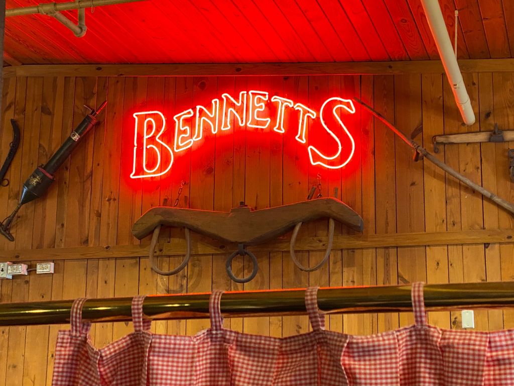 sign on the wall inside bennett's barbecue that says bennett's