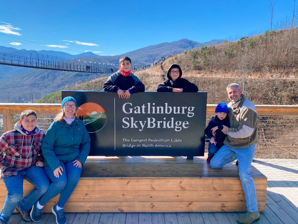 the author and her family at the gatlinburg skybridge sign