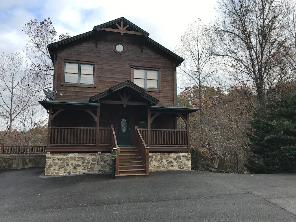 exterior of two story dark wood cabin