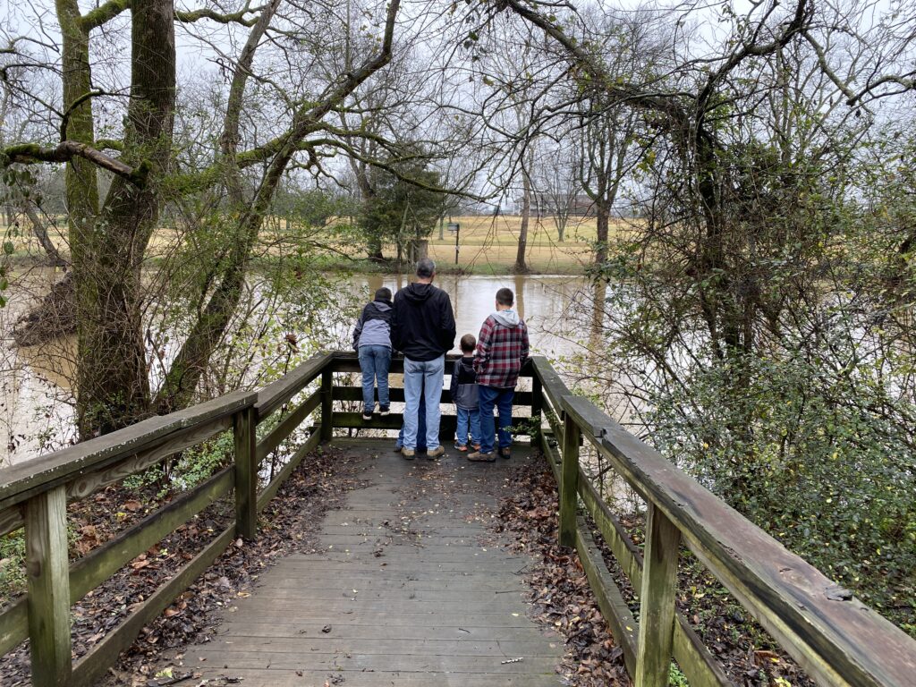 author's husband and sons on Stones River Greenway