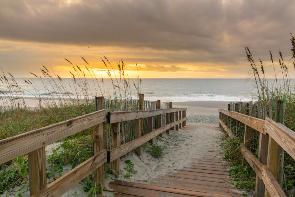 Sunrise along boardwalk over a sand dune in Myrtle Beach, South Carolina