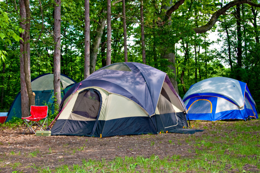 Camping Tents at Campground during Daytime in Woods