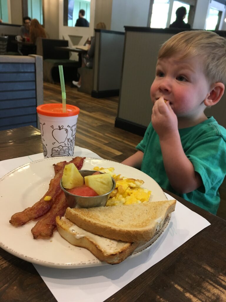 author's youngest son eating breakfast at First Watch